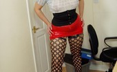 English MILF 170612 Hot N Horny Secretary In Tight Red Rubber Mini And Fishnets
