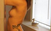 Revenge TV Inked Cutie Stripping In Front Of The Mirror
