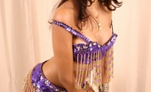 Polliana 185266 Polliana Does A Dance And Shakes Her Hips Wearing A Purple And Gold Beaded Brazilian Carnaval Outfit.
