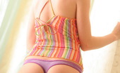 Skye Model 197433 Perky Blonde Teen Skye Teases In A Sexy Tiny Colorful Top And A Purple Thong
