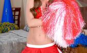 Wicked.com Capri Anderson 216319 Brunette Teen In Cheerleader Uniform Capri Anderson Teasing With Nude Doggy Pose

