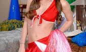 Wicked.com Capri Anderson 216319 Brunette Teen In Cheerleader Uniform Capri Anderson Teasing With Nude Doggy Pose
