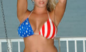 Amber at Home Independence Chick 228487 Amber Poses In Her Stars And Stripes Bikini To Get Ready For Her July 4th House Party.
