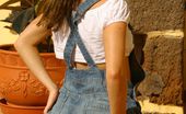 Only Carla Beautiful Brunette Carla Enjoys The Sun In A Casual Dungaree Minidress
