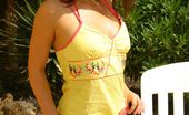 Only Carla 234927 Beautiful Brunette Carla Relaxes In The Sun In A Yellow Top And Pink Bikini. (Non Nude)
