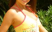 Only Carla 234927 Beautiful Brunette Carla Relaxes In The Sun In A Yellow Top And Pink Bikini. (Non Nude)
