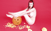 Gothic Sluts Szandora 236210 Busty Redhead Goth Eats Jack O Lantern
