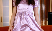 Nubiles Roberta 240185 Nubile Princess Roberta Flirtatiously Models In Her Cute Satin Dress
