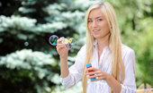 Nubiles Diana Fox 240460 Girl Next Door Blows Bubbles In Her Backyard While Nearly Naked
