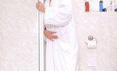Nubiles Monika Benz 242279 Take A Peek Of This Alluring First Timer Monika Benz Wears Bathrobe Flirting In The Shower Room
