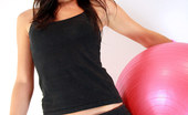 Nubiles Candace Exotic Beauty Candace Sitting And Flirting As She Sits On A Red Exercise Ball

