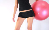 Nubiles Candace 242639 Exotic Beauty Candace Sitting And Flirting As She Sits On A Red Exercise Ball
