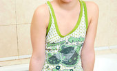 Nubiles Natalia 244885 Blonde Pretty Flirt Natalia Slides Her Tops And Posing So Hot On The Bathroom
