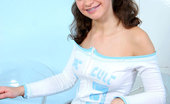 Nubiles Olga 245160 Glamourous Sporty Teen On Chair With Braced In Teeth Temptingly Shows Flowered Panty
