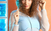Nubiles Tatiana 246715 Long Curly Haired Tatiana Loves Listening To Romantic Music As Her Hobby

