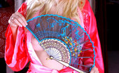 Nubiles Jess 246949 Alluring Blonde Teen Posing Her Fuckable Body With A Nice Red Kimono Dress
