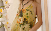 Nubiles Emanuelle 248064 Seductive College Girl Admires Herself In A Flimsy Summer Dress
