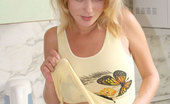 Nubiles Milana 248358 Blonde Milana Slowly Inching Up Her Yellow Blouse In The Kitchen

