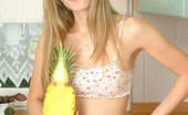 Nubiles Kirsten 248478 Long Haired Teen Blonde Posing And Playing With Toy Fruit In The Kitchen
