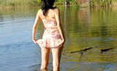 Nubiles Holly 248588 Alluring Holly Stripping All Her Clothes Till Gets Totally Naked In The Lake
