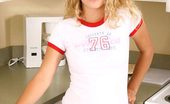 Nubiles Hallee 249860 Hot Brunette Teen With Curly Hair Taking Off Her Shirt And Posing In The Kitchen
