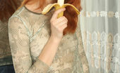 Nubiles Olive 250253 Cute Redhead Olive Plays Around With A Banana And Then Eats It
