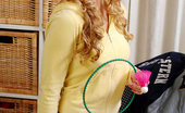 Nubiles Cristal 250361 Hottie Sits And Smiles With Her Golden Curls Down And Her Badminton Racket Out

