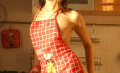 Nubiles Adel 250479 Sexy Girl Adel Has Some Fun In The Kitchen Wearing Only An Apron And A Thong
