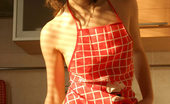 Nubiles Adel 250479 Sexy Girl Adel Has Some Fun In The Kitchen Wearing Only An Apron And A Thong
