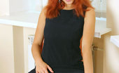 Nubiles Dasha 251022 Dasha Is In A Tight Black Long Dress And Just Showing Off With Her Red Hair Down
