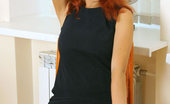 Nubiles Dasha Dasha Is In A Tight Black Long Dress And Just Showing Off With Her Red Hair Down
