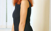 Nubiles Dasha 251022 Dasha Is In A Tight Black Long Dress And Just Showing Off With Her Red Hair Down
