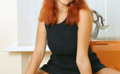 Nubiles Dasha 251022 Dasha Is In A Tight Black Long Dress And Just Showing Off With Her Red Hair Down
