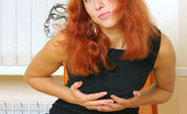 Nubiles Dasha 251022 Dasha Is In A Tight Black Long Dress And Just Showing Off With Her Red Hair Down
