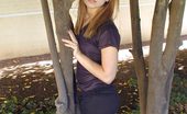 Nubiles Lilian 252528 Redhead In A Short Black Dress Climbs A Tree
