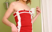 Nubiles Kari 252584 Seductive Teen Tugs At Her Dress Straps
