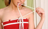 Nubiles Kari 252584 Seductive Teen Tugs At Her Dress Straps
