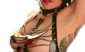 Michelle Aston 256989 Tattooed Busty Milf In Chain And Leather Harness
