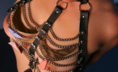Michelle Aston 256989 Tattooed Busty Milf In Chain And Leather Harness
