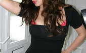 Nylon Jane 261512 Wearing A Sleek Black Dress And Stockings
