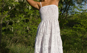 Showy Beauty Terra Girlhood Cutenakedgirl 273072 Enchanting Teen With An Innocent Look Taking Off White Dress And Posing Naked In The Nature.
