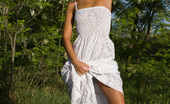 Showy Beauty Terra Girlhood Cutenakedgirl 273072 Enchanting Teen With An Innocent Look Taking Off White Dress And Posing Naked In The Nature.
