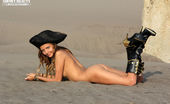 Showy Beauty Caramel Pirate Teenpirate 273085 Beautiful Long Haired Teen Cutie Posing In Black Pirate Hat And Boots Near The Huge Rock.
