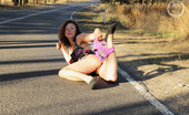 Girls Out West Luka Roadside 303922 Luka Needs A Lift. She'S On Her Way Back To The USA But Wants A Thrill First. Roadside She'S Trying To Hail A Passing Car. No-Body Is Stopping. She Flashes Her Tits, Then Her Hairy Pussy, And Almost Gets A Ride.
