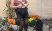 TAC Amateurs Girdle Garden Playtime 317269 Girdlegoddess In Her Black Open Bottom Girdle, Enjoys Some Play Time In The Garden.
