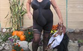 TAC Amateurs Girdle Garden Playtime 317269 Girdlegoddess In Her Black Open Bottom Girdle, Enjoys Some Play Time In The Garden.
