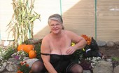 TAC Amateurs Girdle Garden Playtime 317269 Girdlegoddess In Her Black Open Bottom Girdle, Enjoys Some Play Time In The Garden.
