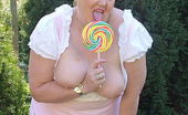 TAC Amateurs Lollipop 317777 Out In The Sun With My Country Gal Frock On Sucking A Huge Lolly
