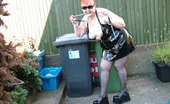 TAC Amateurs Hot In PVC 318304 Black PVC And A HOT Day Makes For Some Cheeky Pics In The Garden.
