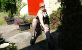 TAC Amateurs Hot In PVC 318304 Black PVC And A HOT Day Makes For Some Cheeky Pics In The Garden.
